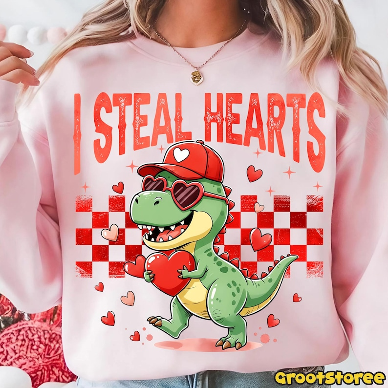 Retro Valentine Dinosaur Holding Heart Shirt Cute I Steal Hearts Vday Shirt Checkered Valentine Shirt Design 1766476058484.png