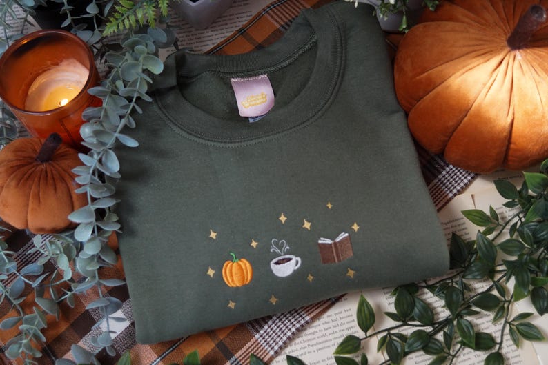 Autumn Icons Pullover Embroidered Jumper   Autumnal Sweatshirt   Fall Inspired Sweater   Pumpkin Coffee Cup And Book Autumn Design 1725954808877.jpg