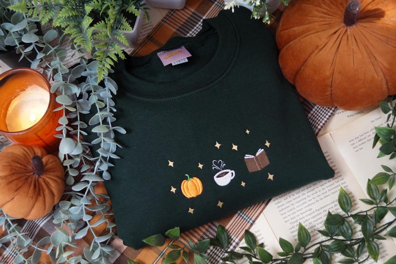Autumn Icons Pullover Embroidered Jumper   Autumnal Sweatshirt   Fall Inspired Sweater   Pumpkin Coffee Cup And Book Autumn Design 1725954808990.jpg