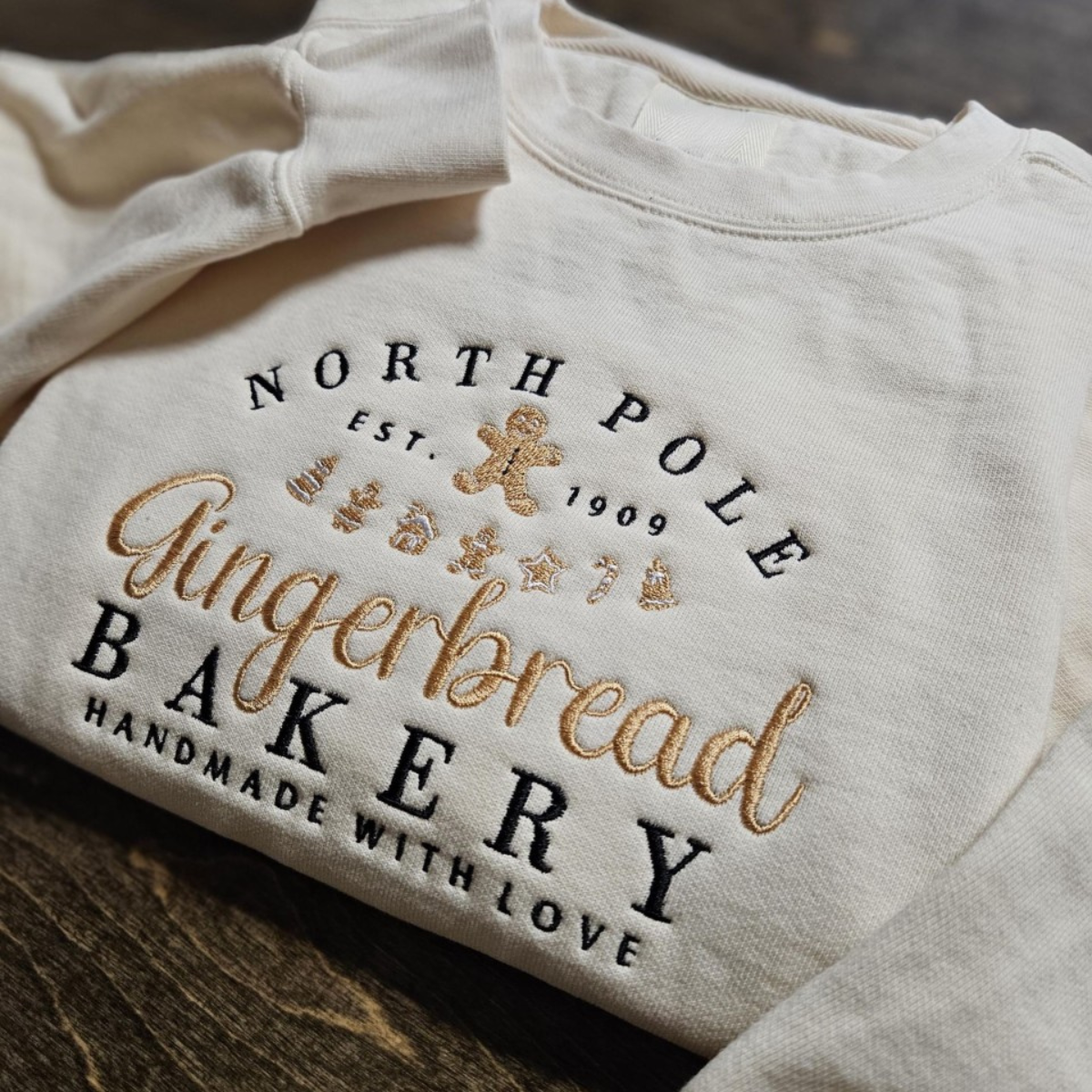 North Pole Gingerbread Bakery Handmade With Love Embroidered Sweatshirt 1728371583387.png