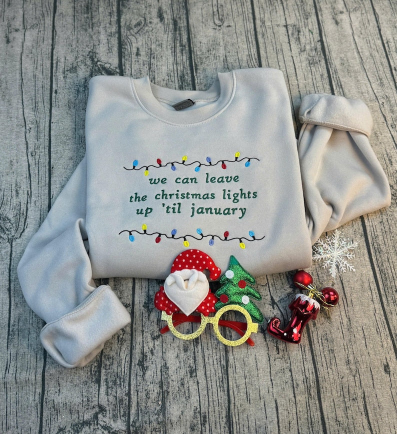We Can Leave The Christmas Lights Up Til January Sweatshirt  Embroidered Christmas Lights Cut Hem Sweatshirt Side Bow Appliqu Sweatshirt 1730362691905.jpg