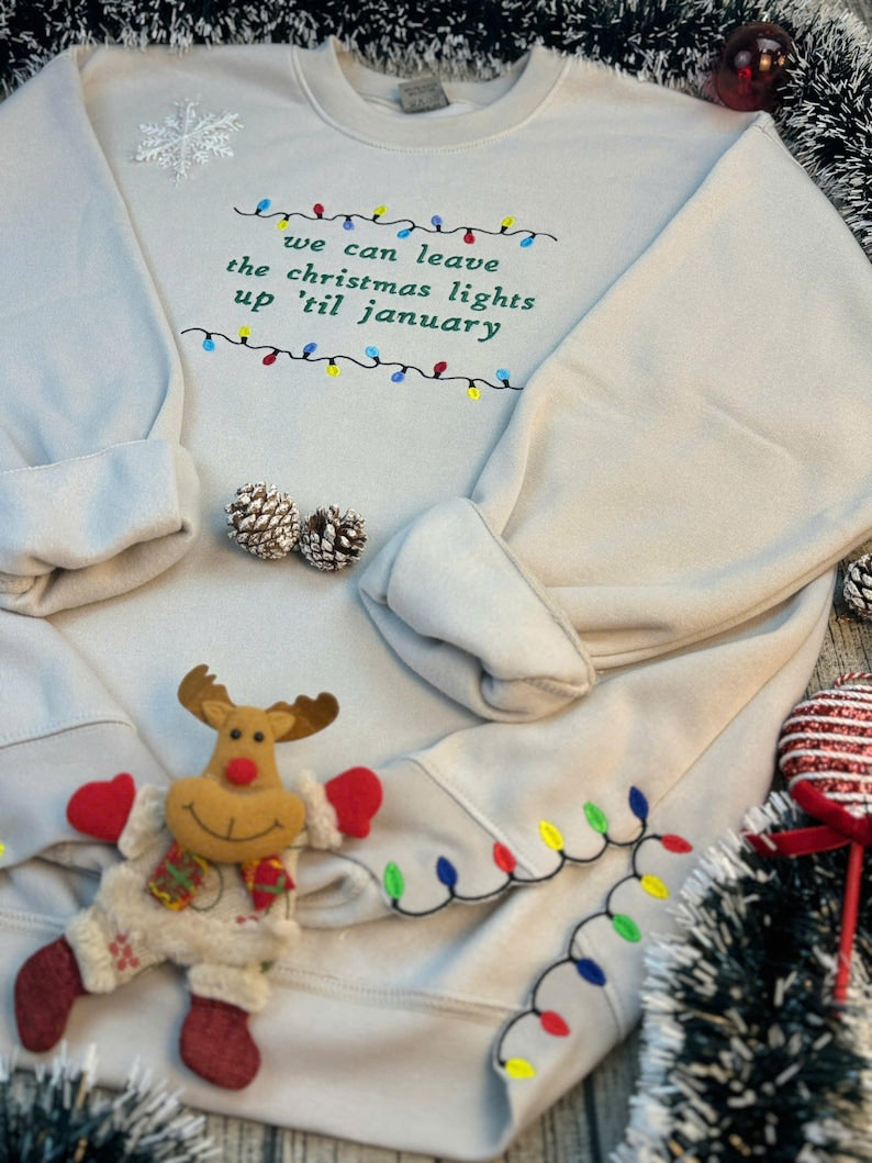 We Can Leave The Christmas Lights Up Til January Sweatshirt  Embroidered Christmas Lights Cut Hem Sweatshirt Side Bow Appliqu Sweatshirt 1730362691910.jpg