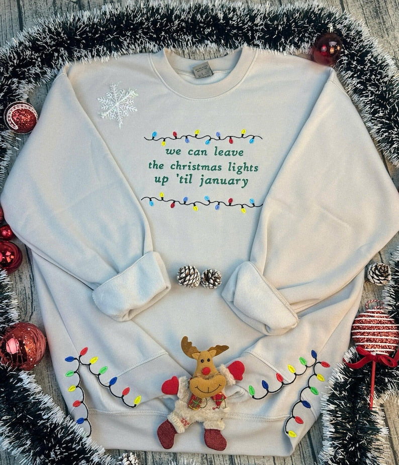 We Can Leave The Christmas Lights Up Til January Sweatshirt  Embroidered Christmas Lights Cut Hem Sweatshirt Side Bow Appliqu Sweatshirt 1730362691929.jpg