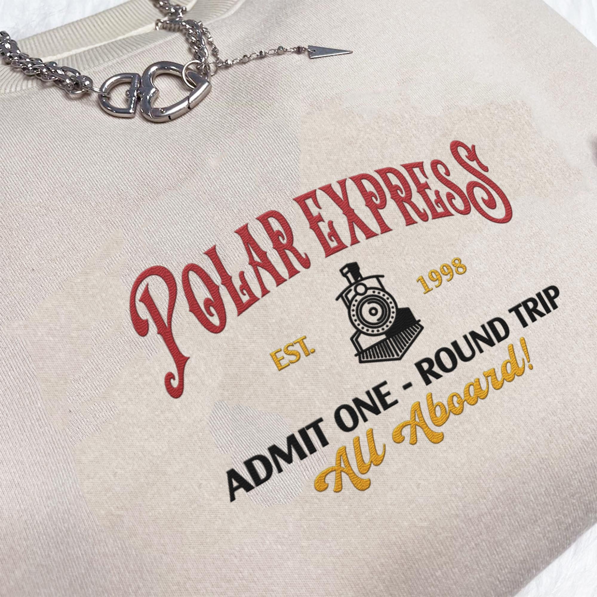 Polar Express Christmas Side Bow Embroidered Sweatshirt Christmas Embroidery Polar Express Crewneck North Pole Christmas Shirt 1732088243768.jpg