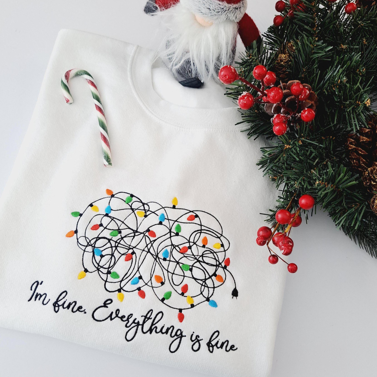 Im Fine Everything Is Fine Tangled Christmas Light Embroidered Sweatshirt 1732855469393.png
