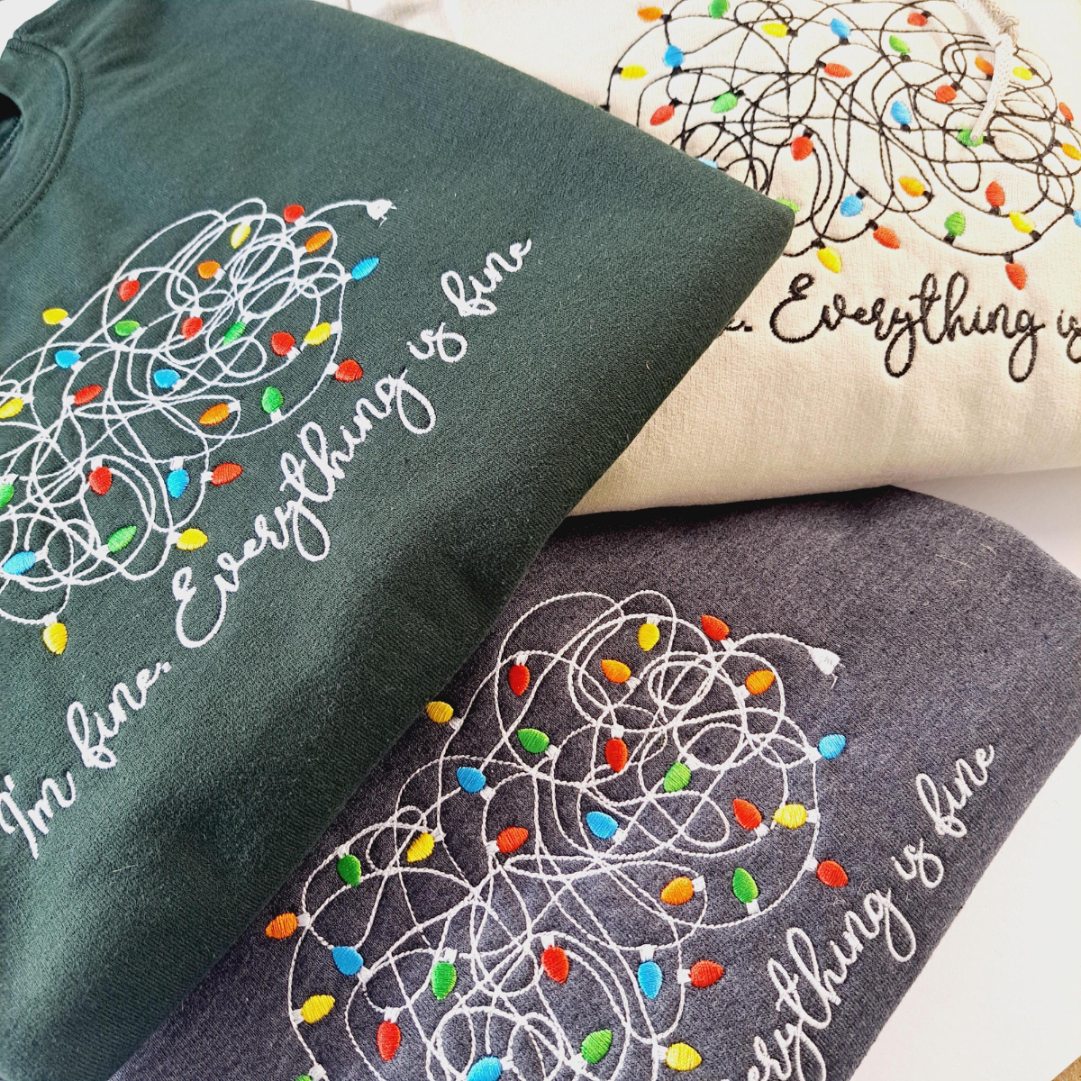 Im Fine Everything Is Fine Tangled Christmas Light Embroidered Sweatshirt 1732855469810.png