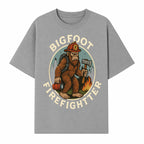 Bigfoot Firefighter T-Shirt | Funny Sasquatch Graphic Tee | Fireman Bigfoot Design | Unique Gift for Firefighters and Nature Lovers - T-shirt 1757912431820.jpg