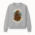 Bigfoot Firefighter T-Shirt | Funny Sasquatch Graphic Tee | Fireman Bigfoot Design | Unique Gift for Firefighters and Nature Lovers - Sweatshirt 1757912433456.jpg