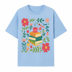 Whimsical Book Stack with Coffee and Flowers Art Print - Cozy Reading Decor for Home or Office - T-shirt 1758093373221.jpg