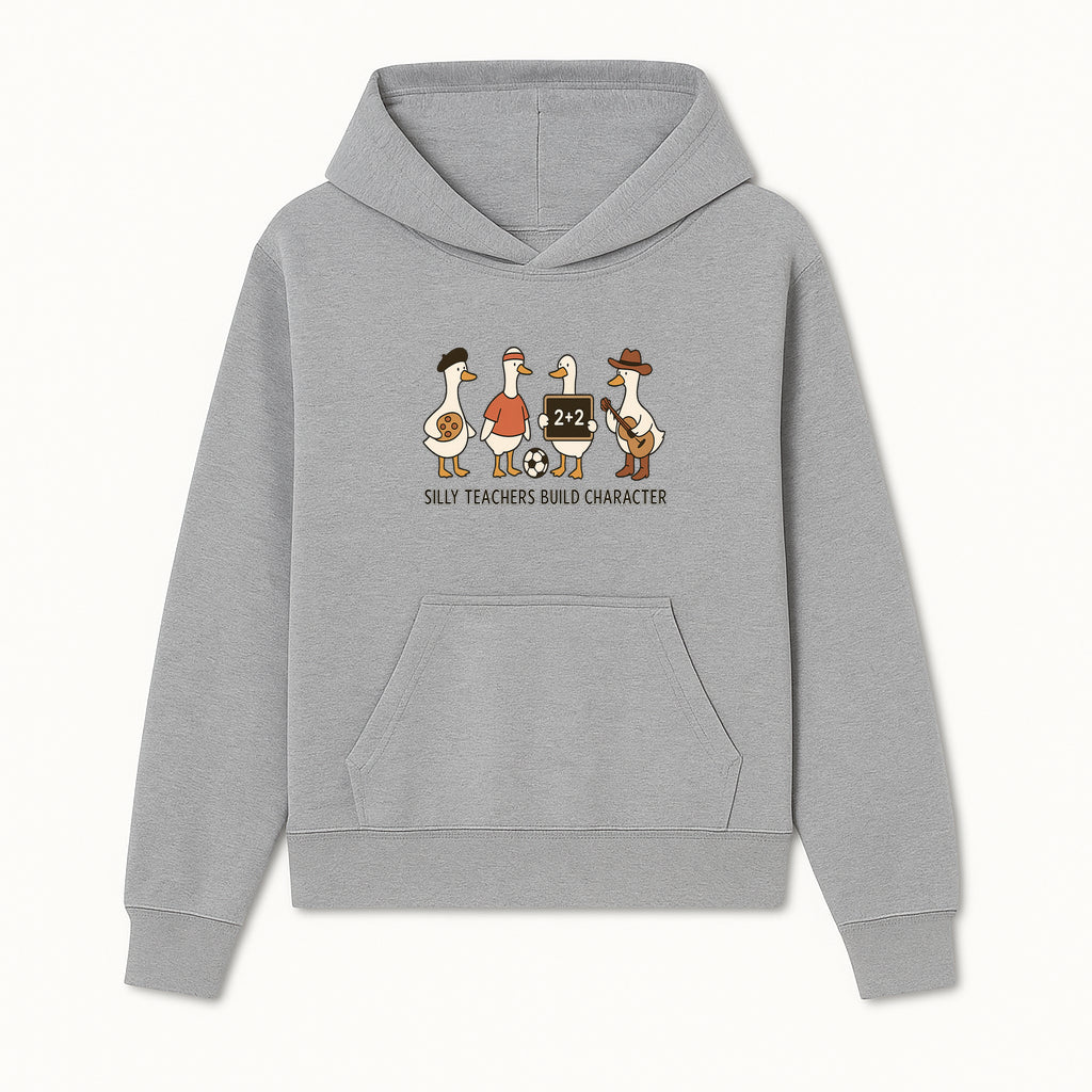 Silly Teachers Build Character Ducks Graphic Tee for Kids Fun Classroom Humor Shirt with Soccer, Music, and Learning Themes - Hoodie 1758093380596.jpg