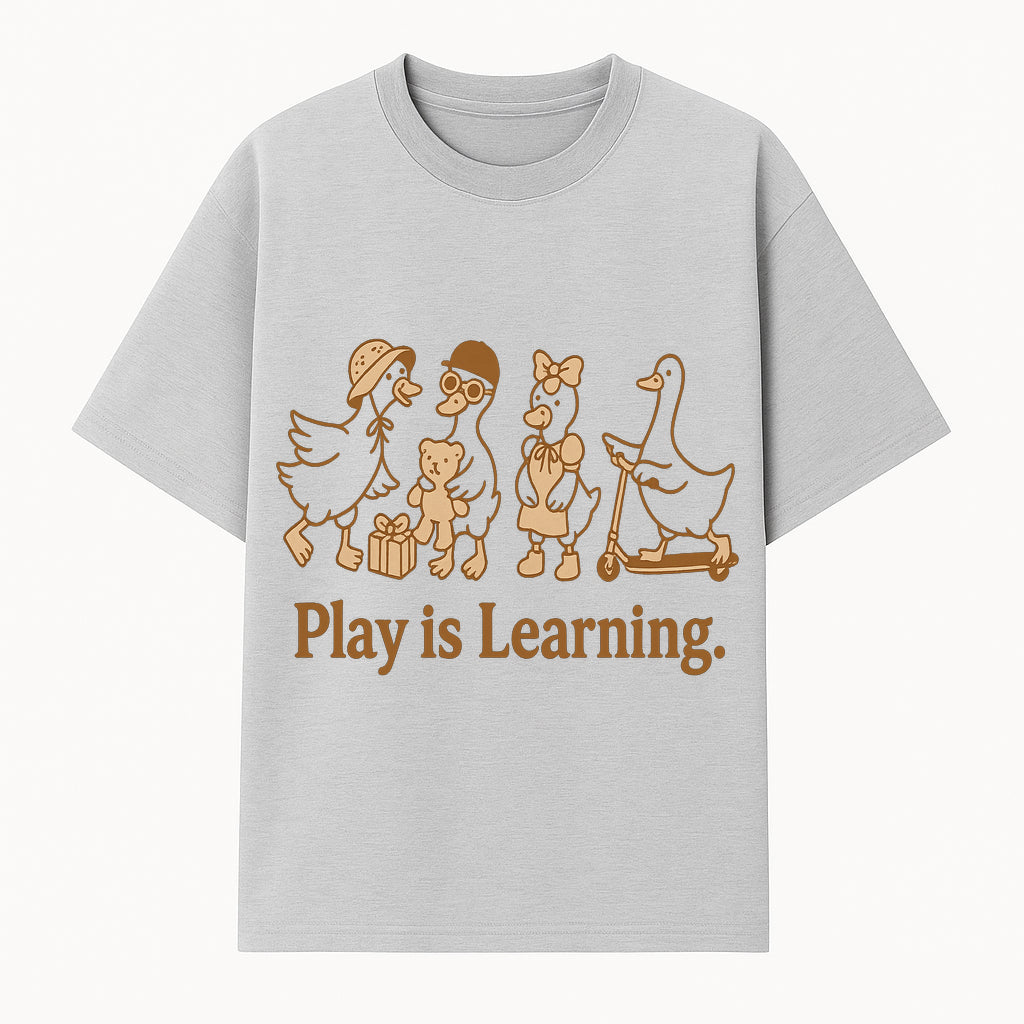 Play is Learning: Cute Cartoon Ducks with Gifts and Toys for Kids' Educational Decor - T-shirt 1758093381360.jpg