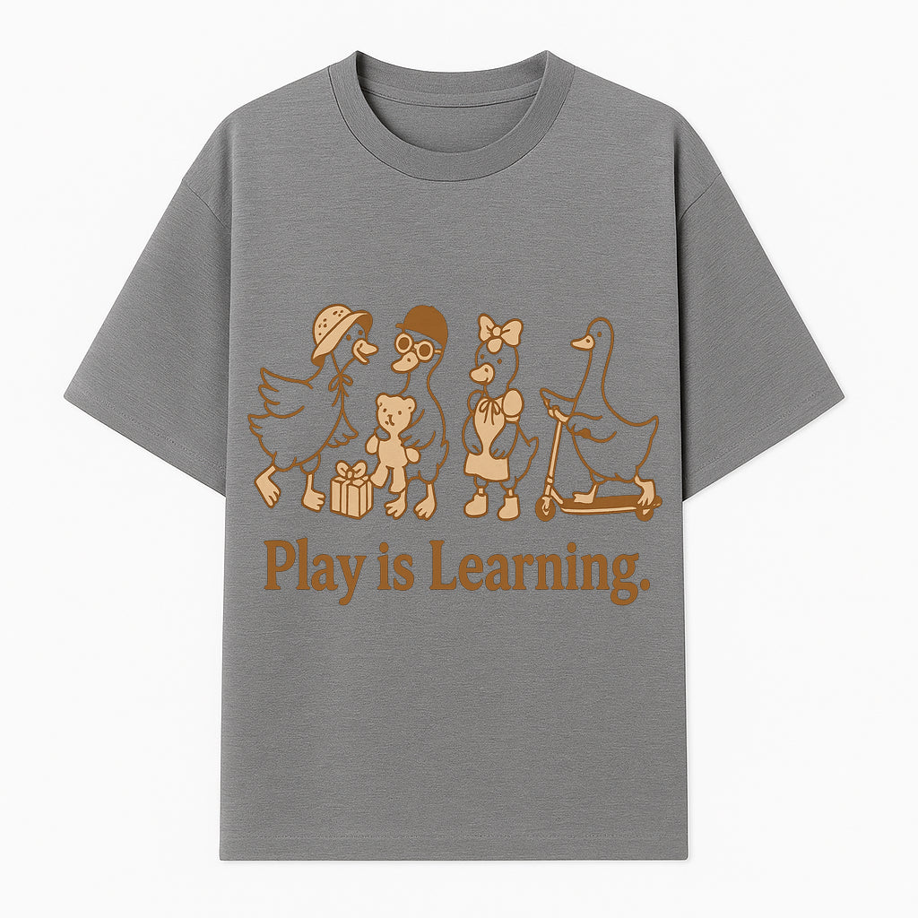 Play is Learning: Cute Cartoon Ducks with Gifts and Toys for Kids' Educational Decor - T-shirt 1758093381999.jpg