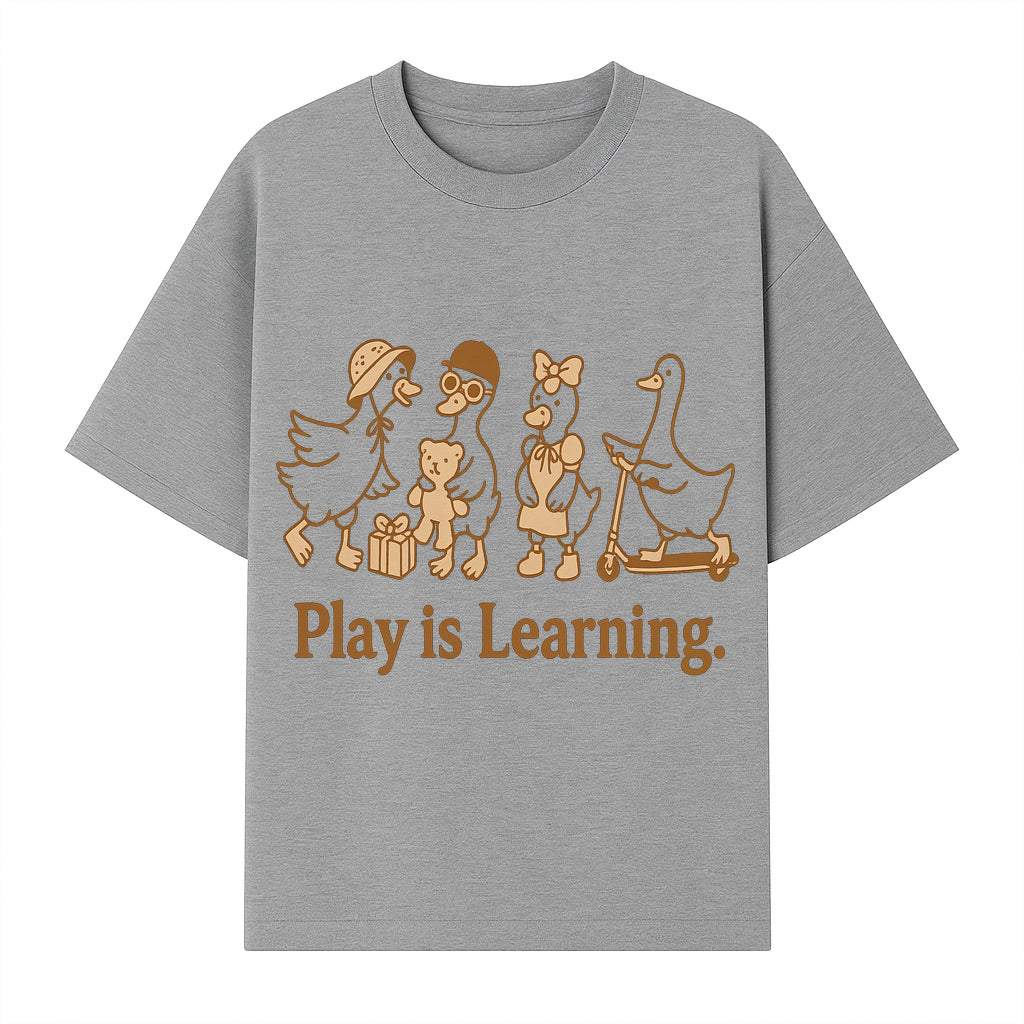 Play is Learning: Cute Cartoon Ducks with Gifts and Toys for Kids' Educational Decor - T-shirt 1758093382945.jpg