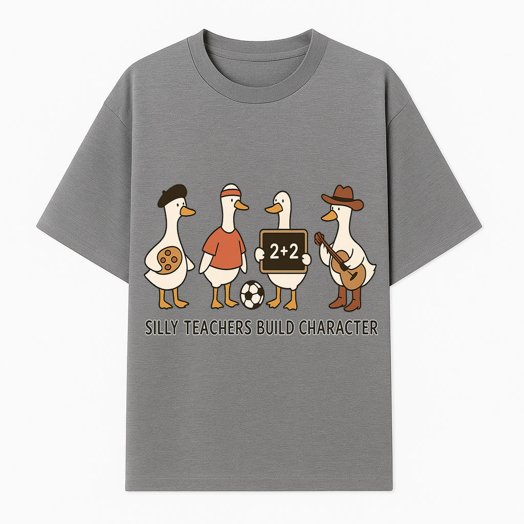 Silly Teachers Build Character Ducks Graphic Tee for Kids Fun Classroom Humor Shirt with Soccer, Music, and Learning Themes - T-shirt 1758093384192.jpg