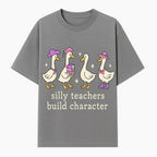Silly Teachers Build Character - Cute Duck Illustration, Educational Gift, Fun Classroom Decor, Teacher Appreciation, Kids Learning - T-shirt 1758093384529.jpg