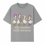 Silly Teachers Build Character - Cute Duck Illustration, Educational Gift, Fun Classroom Decor, Teacher Appreciation, Kids Learning - T-shirt 1758093385529.jpg
