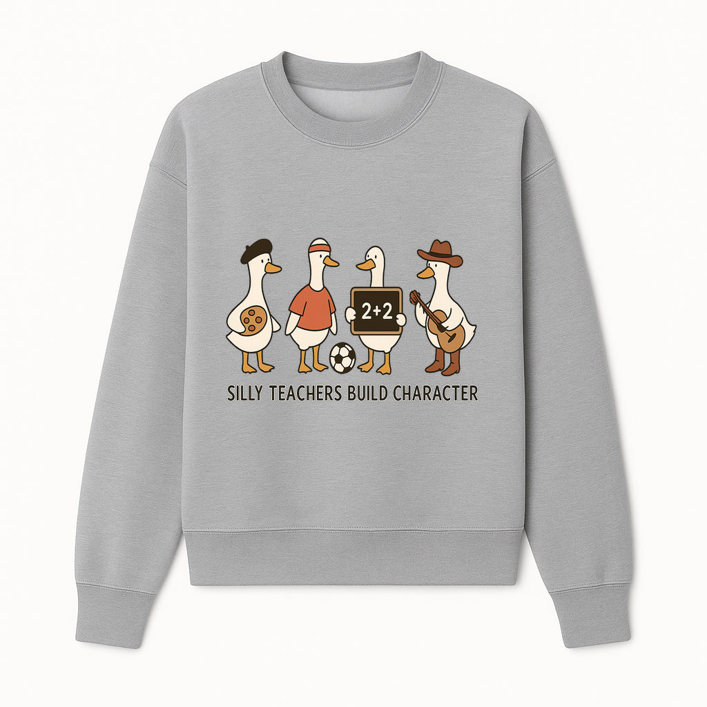 Silly Teachers Build Character Ducks Graphic Tee for Kids Fun Classroom Humor Shirt with Soccer, Music, and Learning Themes - Sweatshirt 1758093386864.jpg