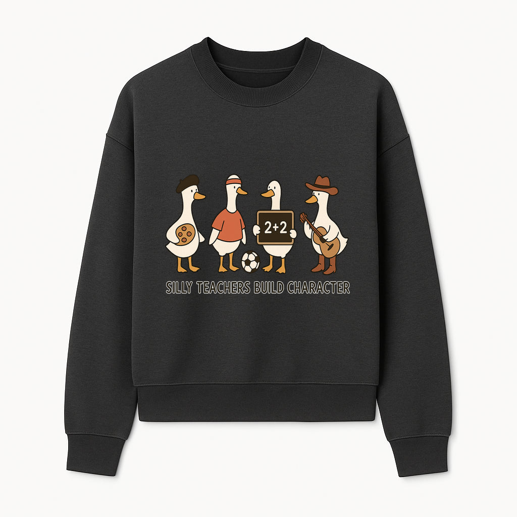 Silly Teachers Build Character Ducks Graphic Tee for Kids Fun Classroom Humor Shirt with Soccer, Music, and Learning Themes - Sweatshirt 1758093387138.jpg
