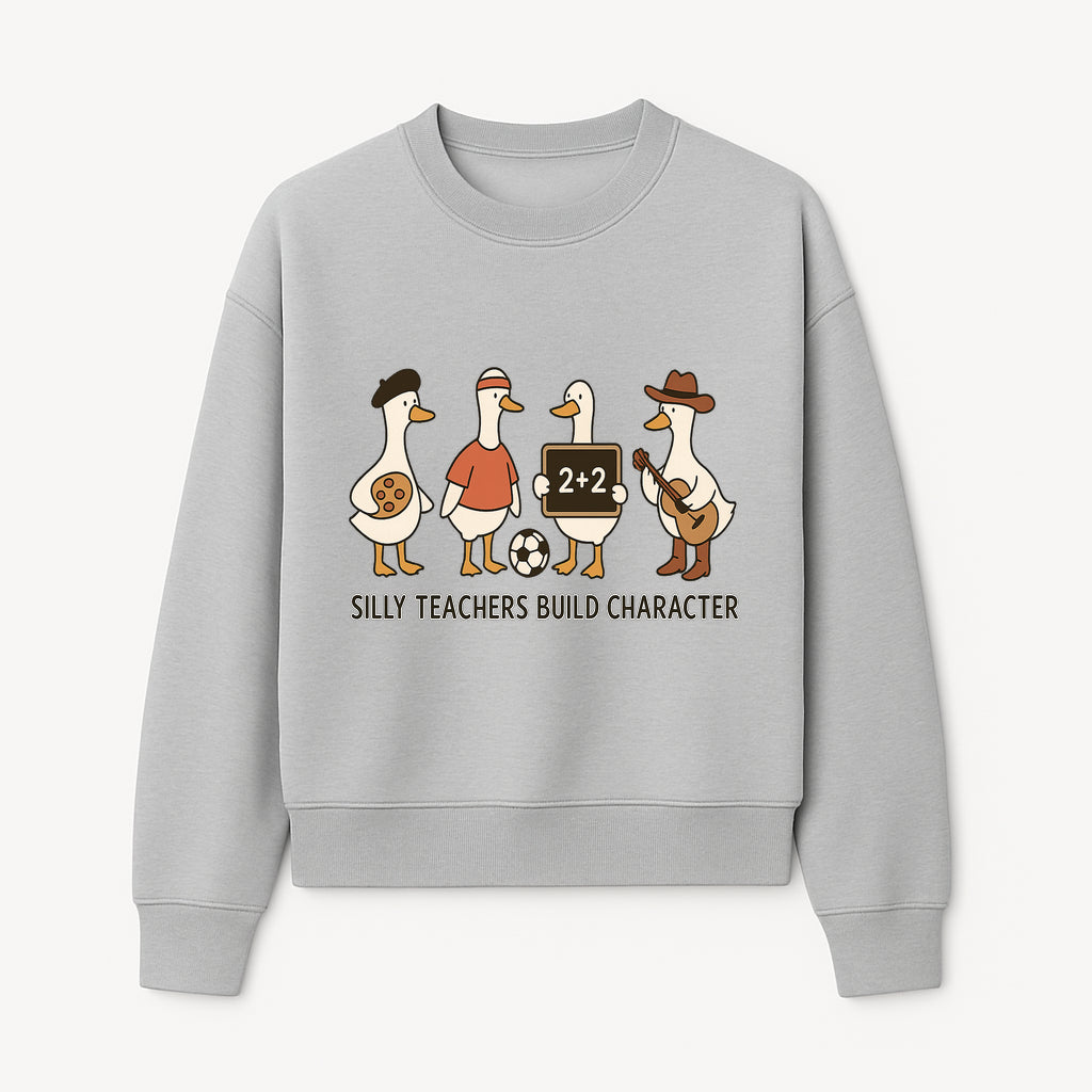 Silly Teachers Build Character Ducks Graphic Tee for Kids Fun Classroom Humor Shirt with Soccer, Music, and Learning Themes - Sweatshirt 1758093387477.jpg