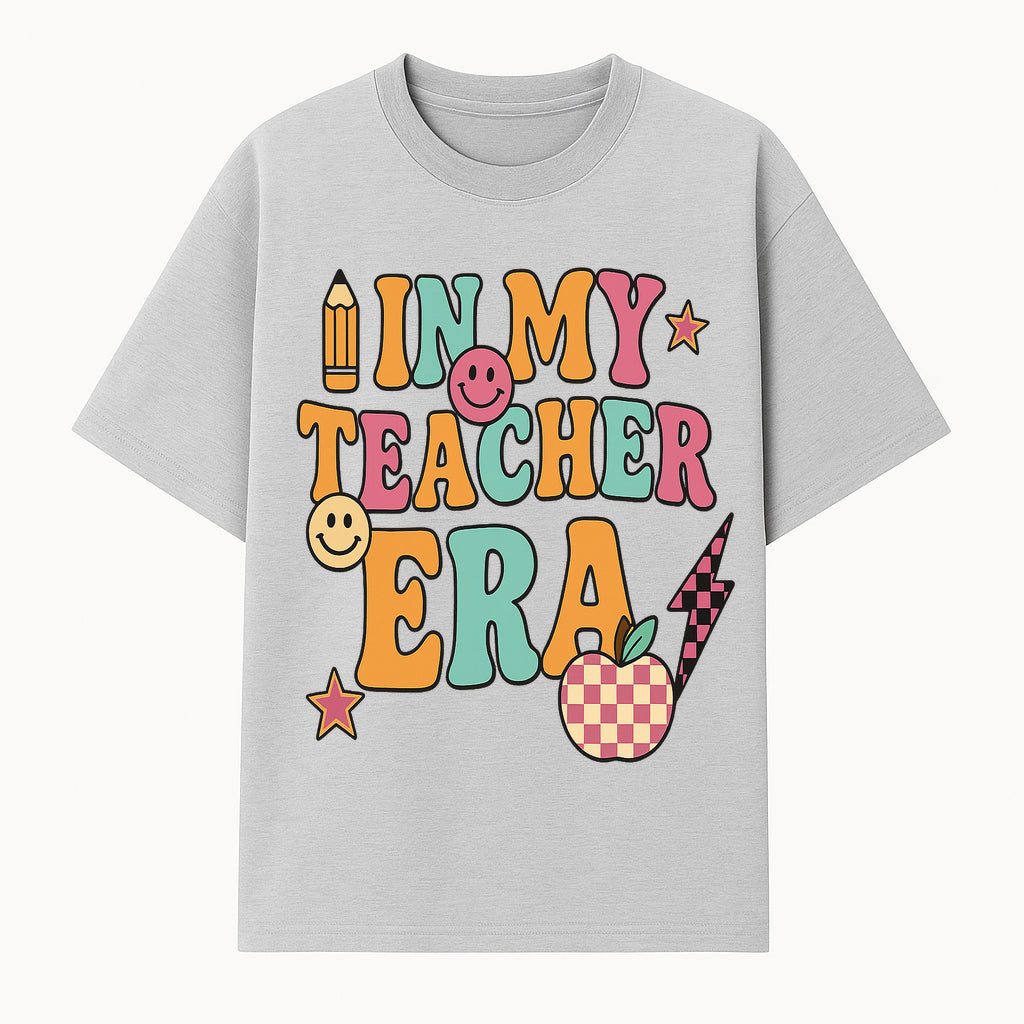 In My Teacher Era Graphic Tee - Retro Style with Happy Faces and School Elements, Perfect for Educators - T-shirt 1758093388692.jpg
