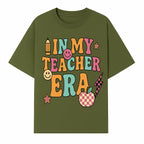 In My Teacher Era Graphic Tee - Retro Style with Happy Faces and School Elements, Perfect for Educators - T-shirt 1758093389179.jpg