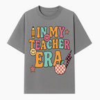 In My Teacher Era Graphic Tee - Retro Style with Happy Faces and School Elements, Perfect for Educators - T-shirt 1758093389387.jpg