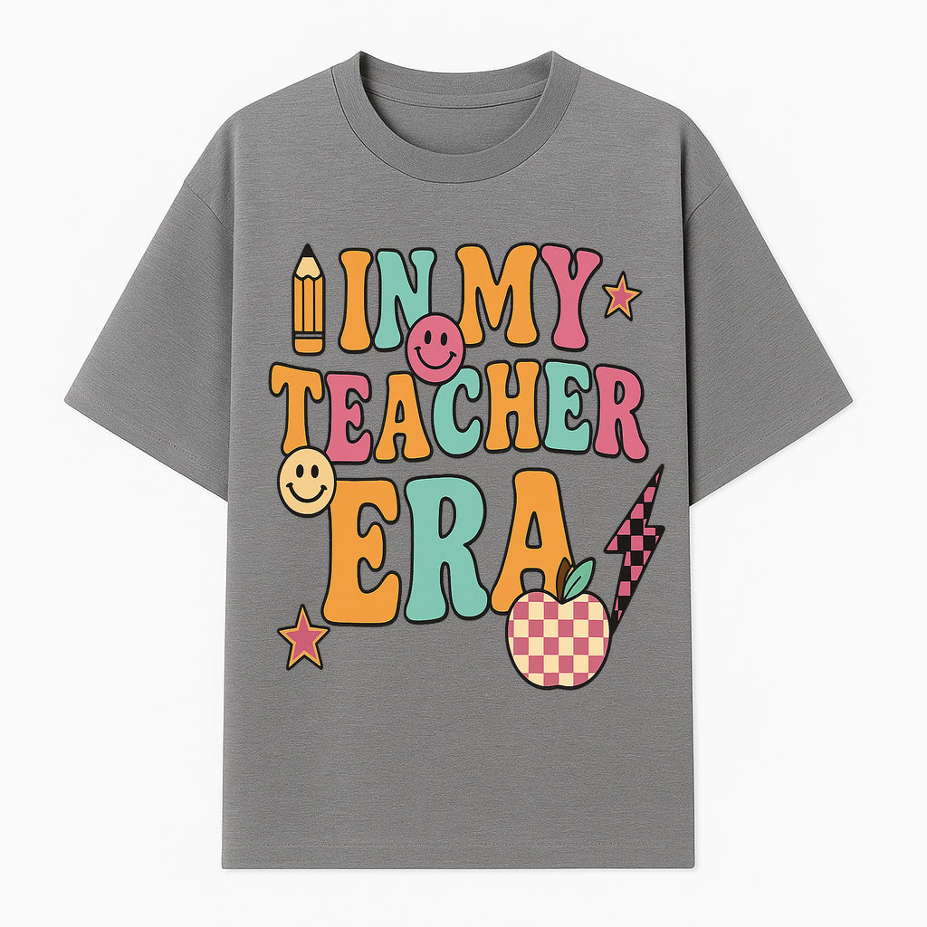 In My Teacher Era Graphic Tee - Retro Style with Happy Faces and School Elements, Perfect for Educators - T-shirt 1758093389387.jpg