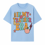 In My Teacher Era Graphic Tee - Retro Style with Happy Faces and School Elements, Perfect for Educators - T-shirt 1758093389580.jpg