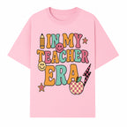 In My Teacher Era Graphic Tee - Retro Style with Happy Faces and School Elements, Perfect for Educators - T-shirt 1758093389722.jpg