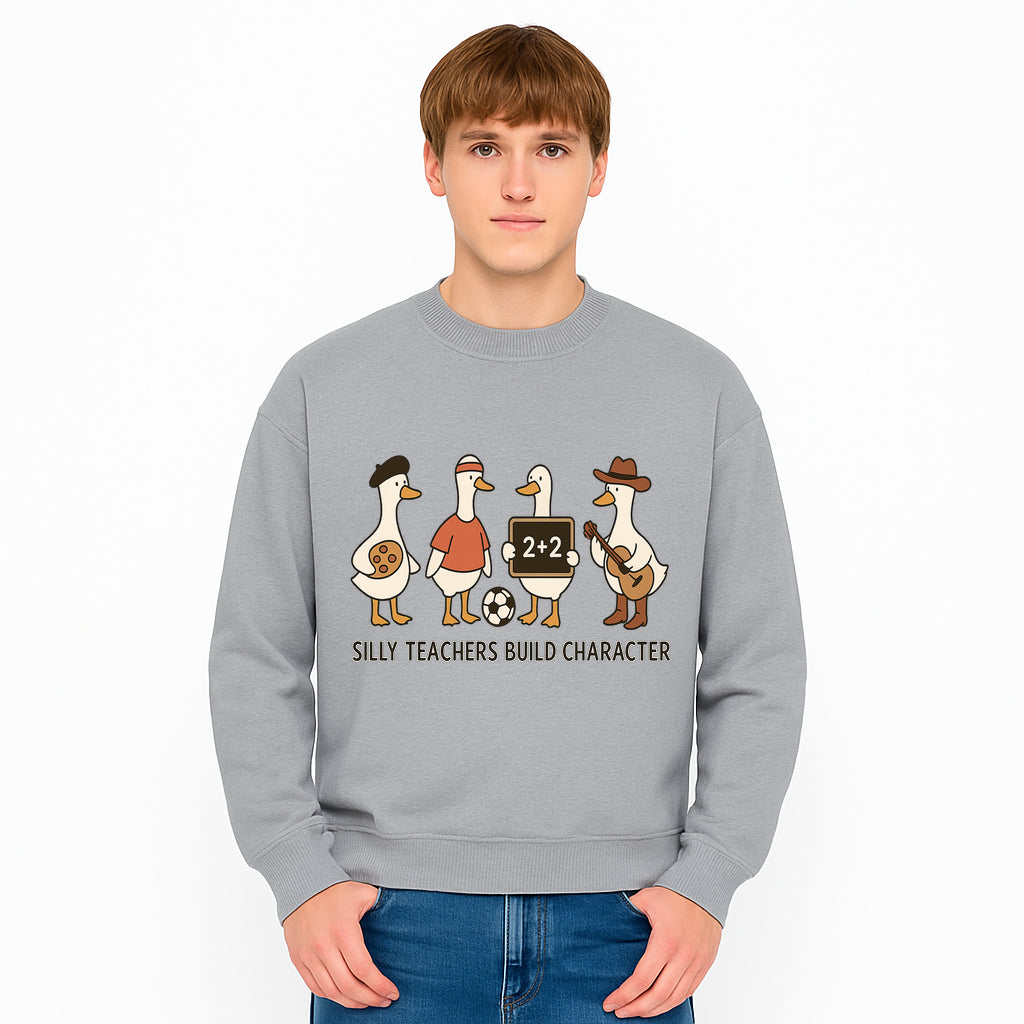 Silly Teachers Build Character Ducks Graphic Tee for Kids Fun Classroom Humor Shirt with Soccer, Music, and Learning Themes - Sweatshirt 1758093389840.jpg