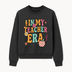 In My Teacher Era Graphic Tee - Retro Style with Happy Faces and School Elements, Perfect for Educators - Sweatshirt 1758093392394.jpg