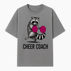 Cheer Coach Raccoon Graphic Tee - Fun & Whimsical Animal Design for Cheerleaders & Coaches, Perfect Gift Idea - T-shirt 1758186552731.jpg