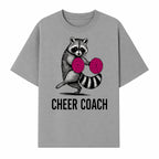 Cheer Coach Raccoon Graphic Tee - Fun & Whimsical Animal Design for Cheerleaders & Coaches, Perfect Gift Idea - T-shirt 1758186553661.jpg