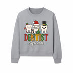 Cute Christmas Dentist Squad T-Shirt with Snowflakes, Toothy Characters, Penguin & Holiday Themes for Dental Professionals and Fans - Sweatshirt 1758250116293.jpg