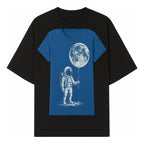 Astronaut Holding Moon Balloon T-Shirt | Space Themed Graphic Tee | Unique Gift for Sci-Fi Lovers and Dreamers - T-shirt 1758273094394.jpg