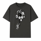 Astronaut Holding Planet Balloons Graphic T-Shirt | Space Adventure Design | Galaxy-Themed Apparel for Kids and Adults - T-shirt 1758273117038.jpg
