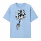 Astronaut Holding Planet Balloons Graphic T-Shirt | Space Adventure Design | Galaxy-Themed Apparel for Kids and Adults - T-shirt 1758273117540.jpg
