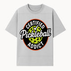 Certified Pickleball Addict T-Shirt | Pickleball Fan Apparel | Funny Sports Gift for Players | Green Paddle Ball Design - T-shirt 1758685032121.jpg