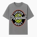 Certified Pickleball Addict T-Shirt | Pickleball Fan Apparel | Funny Sports Gift for Players | Green Paddle Ball Design - T-shirt 1758685032677.jpg