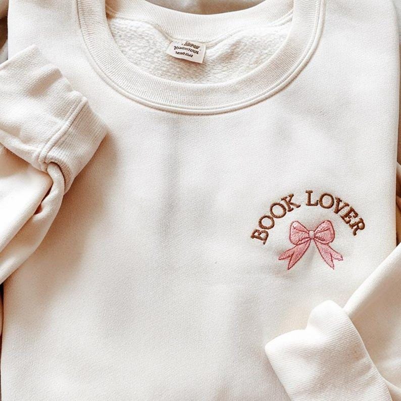 Embroidered Coquette Book Lover Sweatshirt Bow Bookish Sweatshirt Gift For Book Lovers Book Lover Hoodie Teacher Appreciation Hoodie 1759375869283.jpg