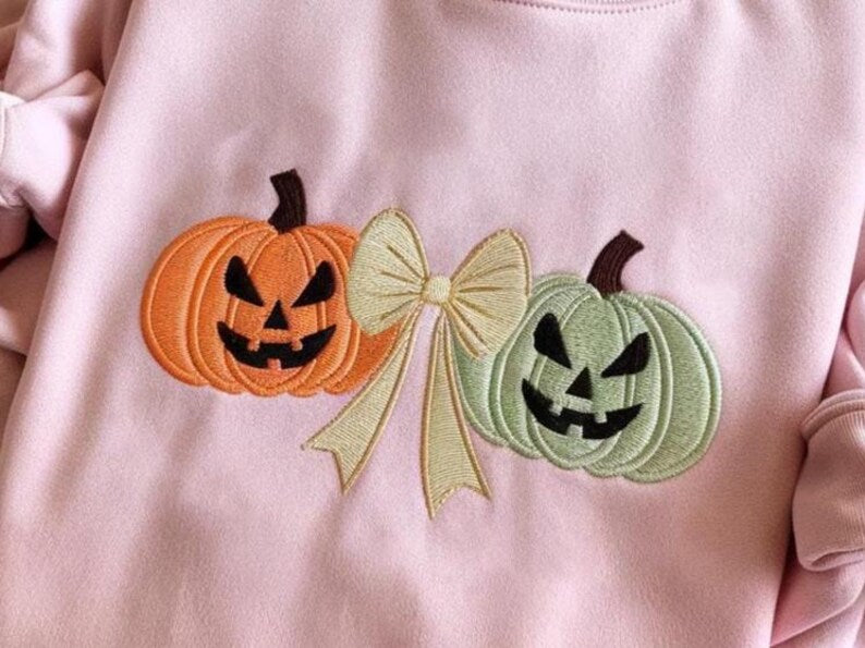 Coquette Bow Embroidered Pumpkins Sweatshirt Cozy Halloween Hoodie Jack O Lantern Sweatshirt Autumn Hoodie Cute Fall Sweatshirt 1760582286015.jpg