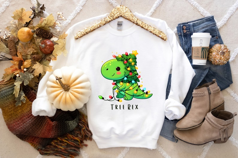 Christmas Dinosaur Light Shirt Christmas Party Shirt Merry Christmas Shirt Funny Christmas Shirt Tree Rex Shirt Santa Dinosaur Shirt 1760584199238.png