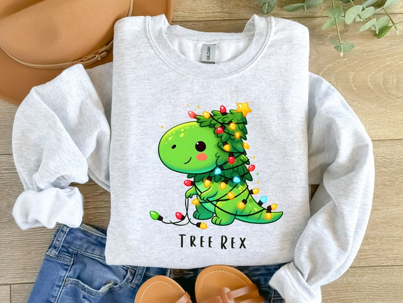 Christmas Dinosaur Light Shirt Christmas Party Shirt Merry Christmas Shirt Funny Christmas Shirt Tree Rex Shirt Santa Dinosaur Shirt 1760584199273.png
