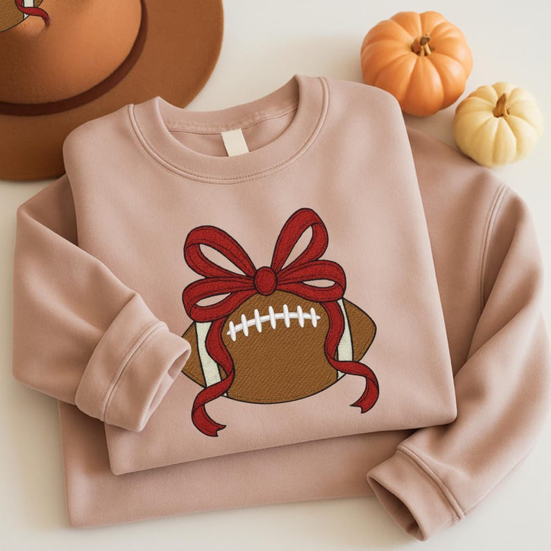 Football With Bow Embroiderer Sweatshirt Cute Sports Ball Embroidered Hoodie Embroidered Football Coquette Sweater 1761965361466.png