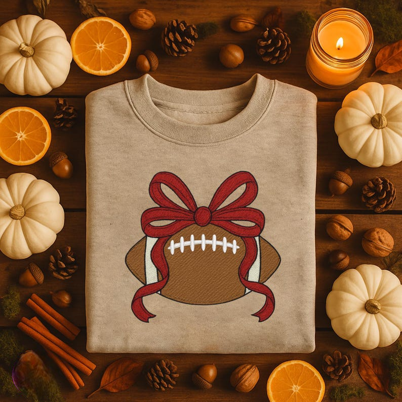 Football With Bow Embroiderer Sweatshirt Cute Sports Ball Embroidered Hoodie Embroidered Football Coquette Sweater 1761965361616.png