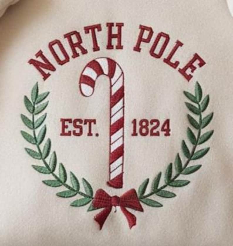 North Pole University Embroidered Sweatshirt  Christmas Embroidered Hoodie  Christmas Candy Sweater 1762412627602.jpg