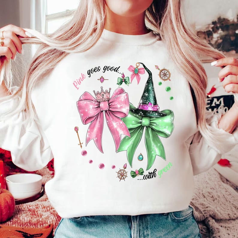Wicked The Movie Sweatshirt Wicked Inspired Bow Pink Goes Good With Green Broadway Movie Elphaba Glinda Coquette Glitter Tee Wizard Of Oz 1763441140132.png