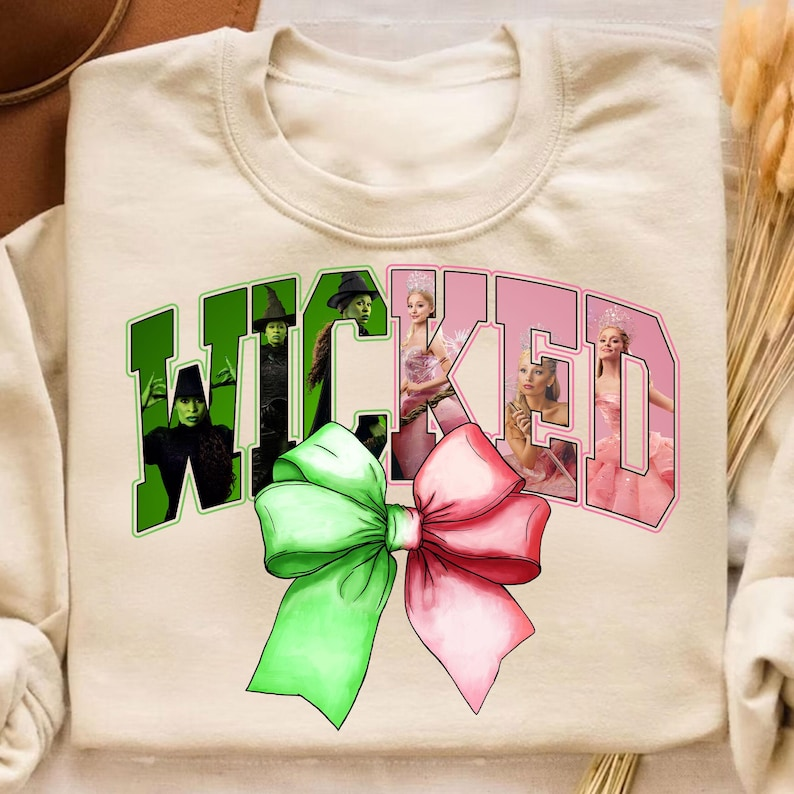 Wicked Coquette Bow Shirt Wicked Inspired Sweatshirt Musical Bow Sweatshirt Green Pink Bow Shirt Changed For Good Shirt Princess Trip Shirt 1763448859987.png