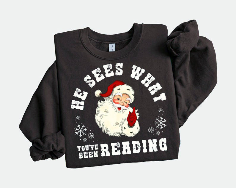 He Sees What Youve Been Reading Santa Sweatshirt Funny Bookish Christmas Santa Sweater Book Lover Gift Xmas Sweatshirt Gift For Her 1763606760063.jpg