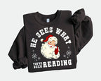 He Sees What Youve Been Reading Santa Sweatshirt Funny Bookish Christmas Santa Sweater Book Lover Gift Xmas Sweatshirt Gift For Her 1763606760063.jpg